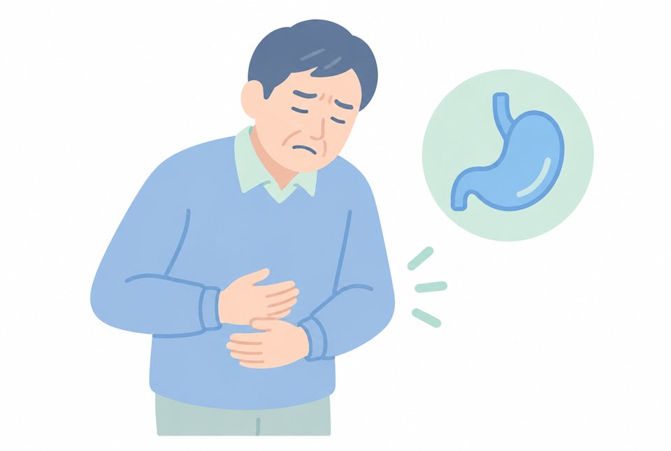 みぞおちを押さえて痛がる中年男性